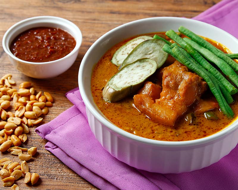 Kare-Kare in a bowl with toasted peanut sauce
